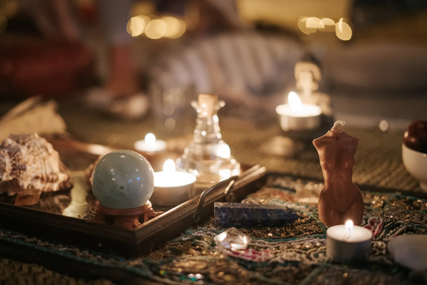 Candlelight on an altar with a crystal ball